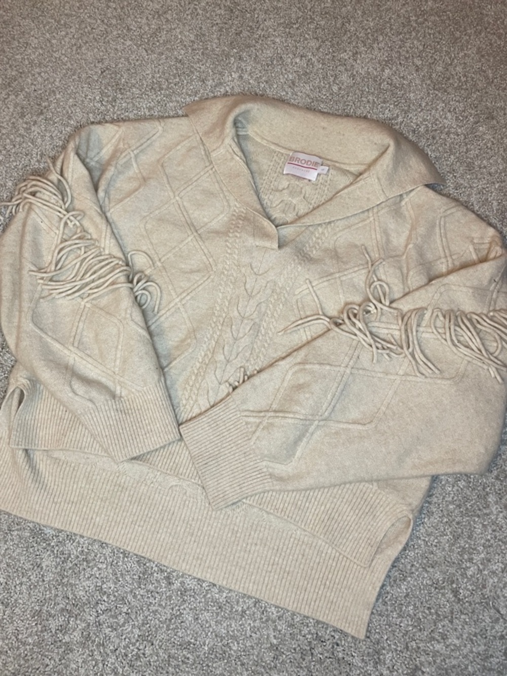 Brodie Cashmere Cream Cable-Knit V-Neck Sweater with Fringe